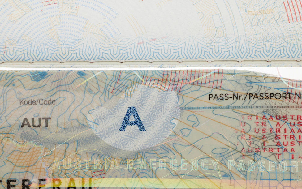 Emergency passport visa with punched Letters highlighted